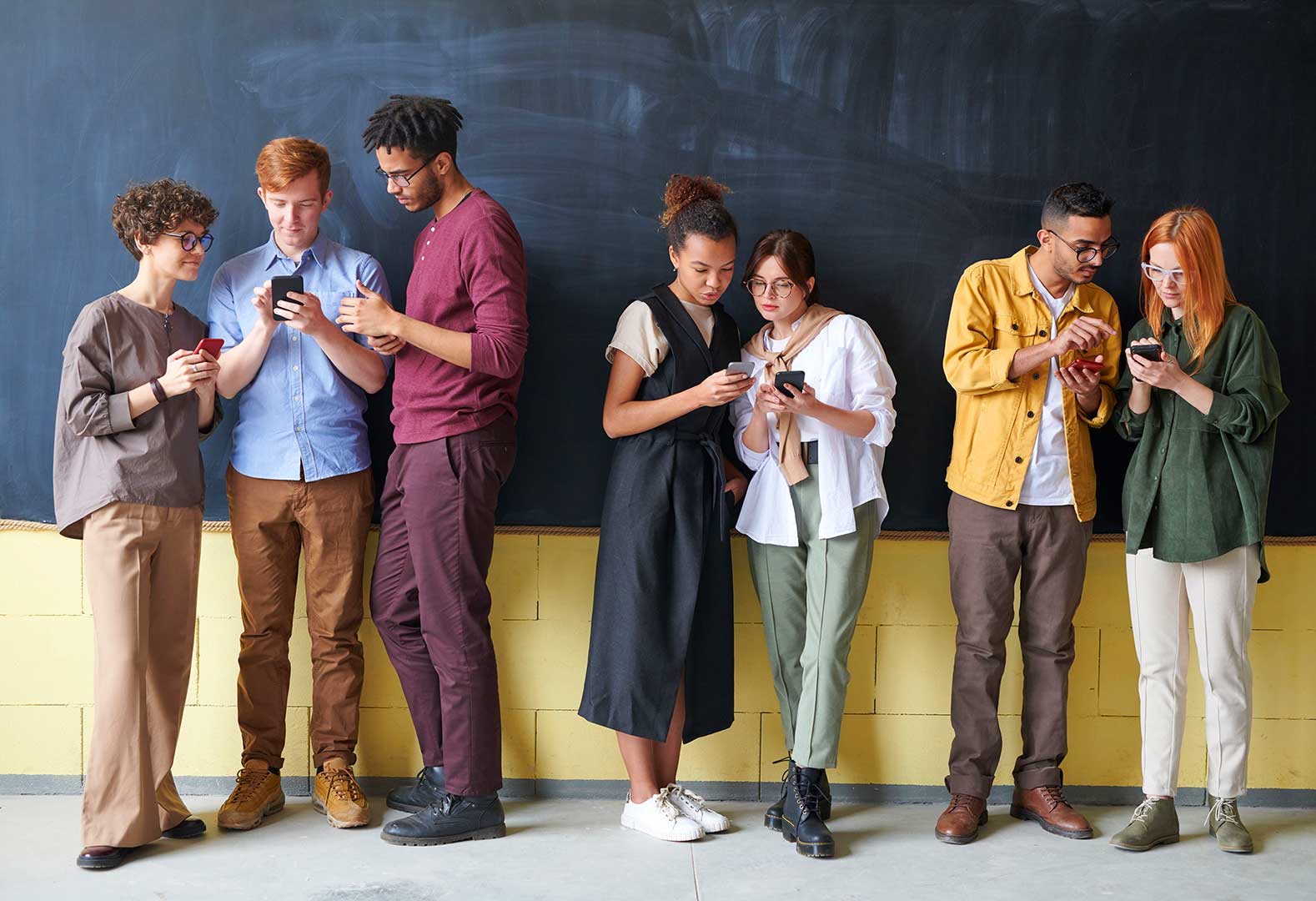 Group of people starting at social media content on their phones